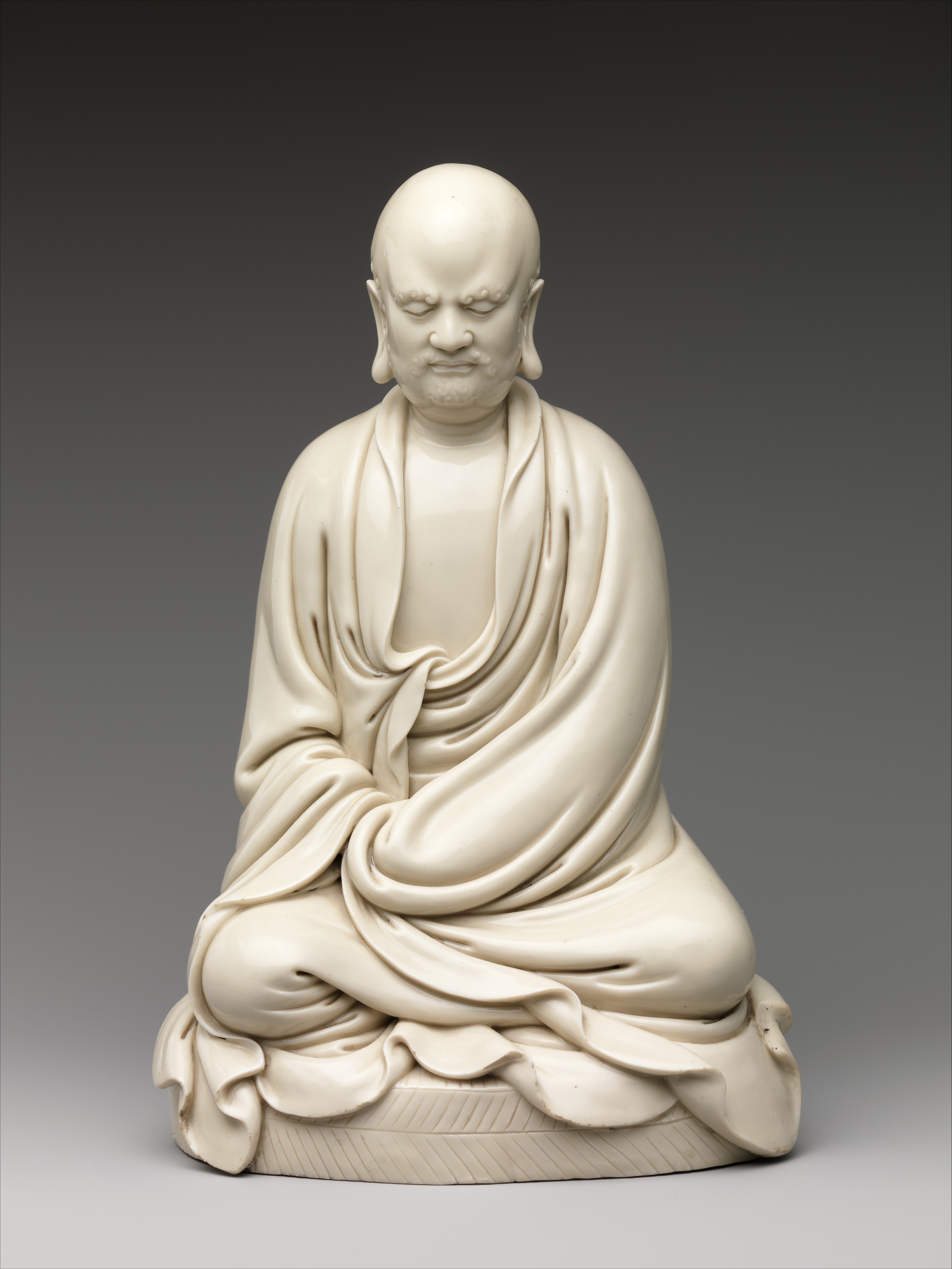 Bodhidharma seated figure attributed to He Chaozong, Dehua white porcelain (Blanc de Chine), c. 17th century, Metropolitan Museum of Art 63.176