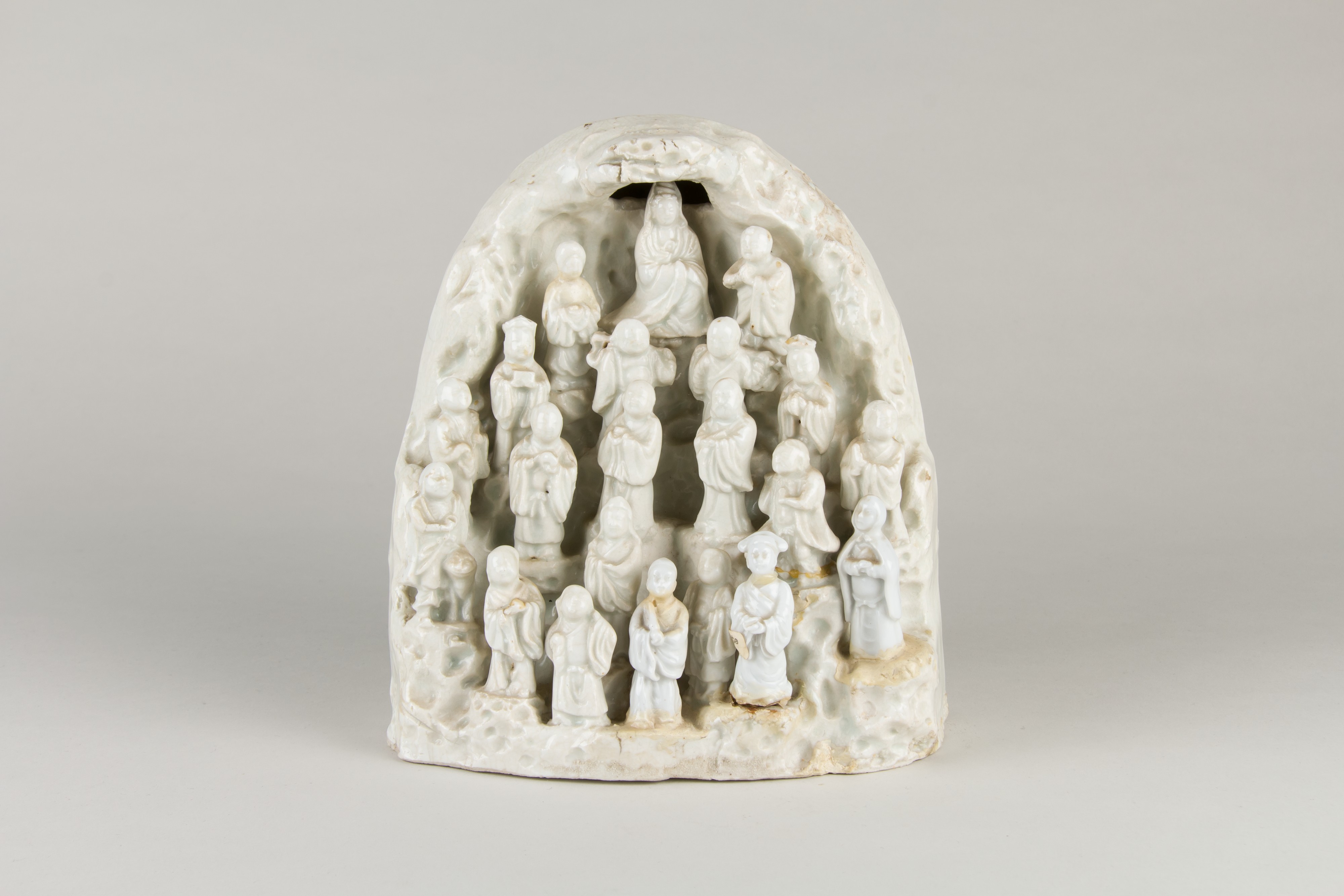 Dehua Blanc de Chine grotto with Guanyin and twenty disciples, 18th century, Metropolitan Museum 1973.155.6 — complex group figures represent Tier III–IV