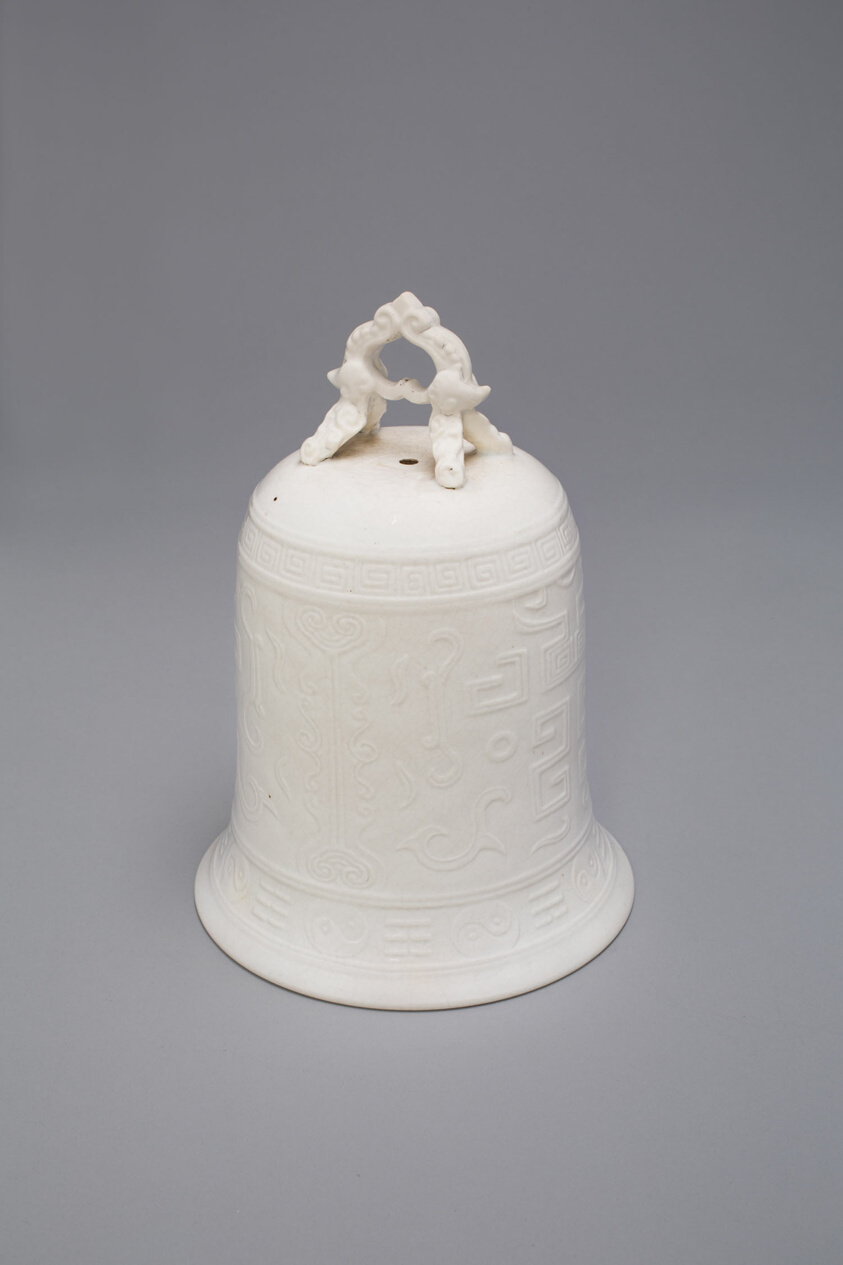 Bell with Archaistic Motifs, Dehua ware (blanc de chine); porcelain with underglaze mold-impressed decoration, Qing dynasty, mid-17th century, H. 16.4 cm, Art Institute of Chicago, 1924.369, Blanc de Chine