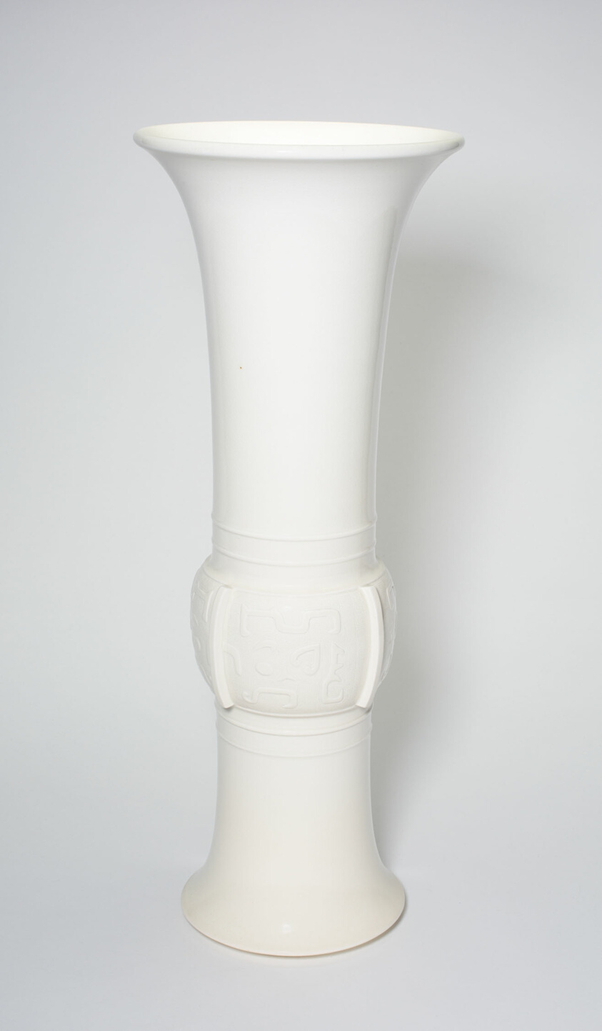 Beaker Vase in the Shape of an Ancient Bronze Beaker (Zun), Dehua ware (Blanc de Chine); porcelain with underglaze molded decoration, Qing dynasty, late 17th–early 18th century, H. 47.2 cm, Art Institute of Chicago, 1924.374, Blanc de Chine