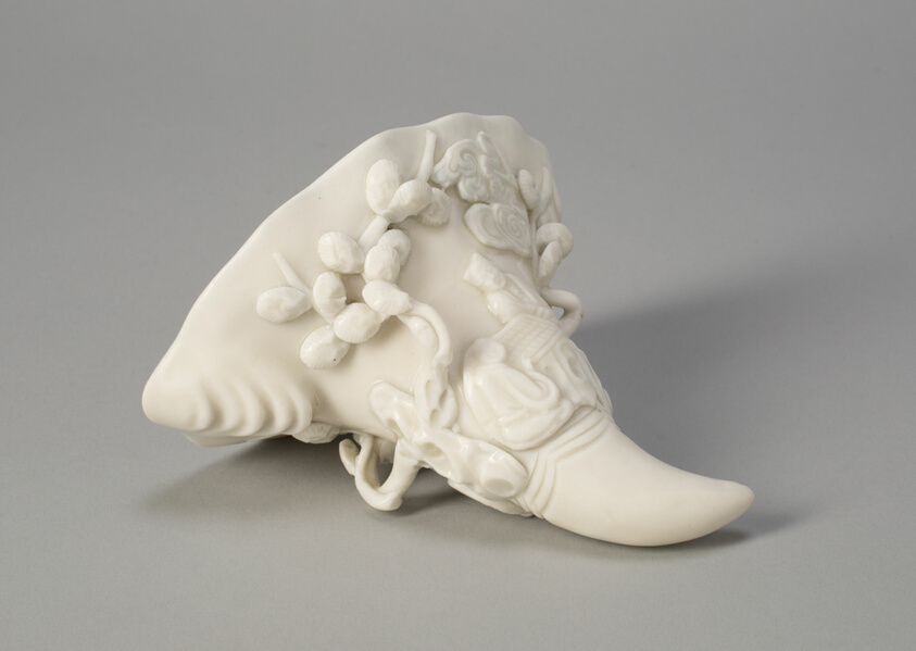 Rhinoceros Horn-Shaped Cup with Figures by a Tree, Dehua ware (blanc de chine); glazed porcelain, Ming dynasty (1368–1644), H. 9.6 cm, Art Institute of Chicago, 1941.542, Blanc de Chine
