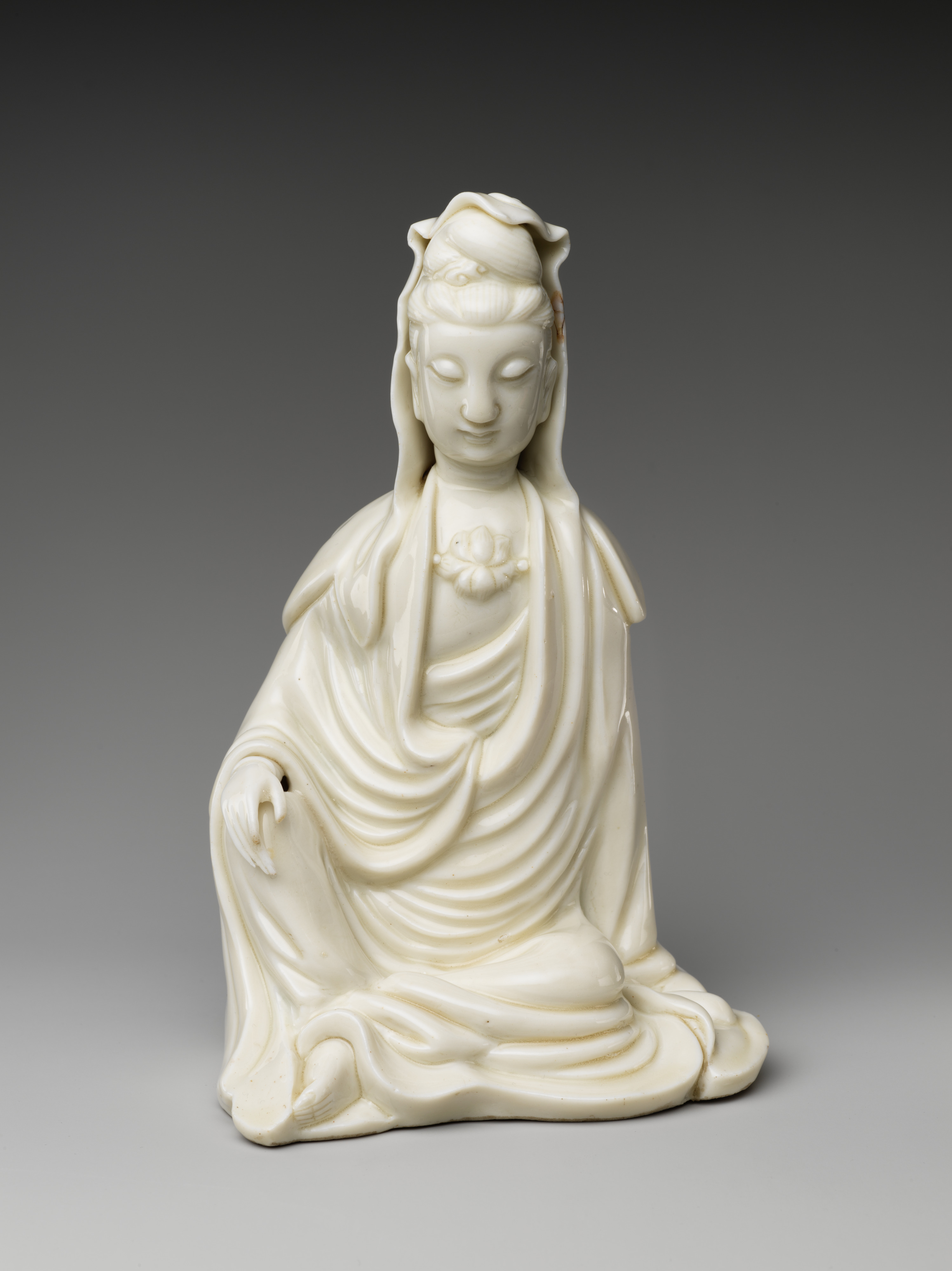 Figure of Seated Bodhisattva Guanyin, Porcelain with white glaze (Dehua ware), 18th century, H. 19.1 cm, The Metropolitan Museum of Art, 14.40.201, Blanc de Chine