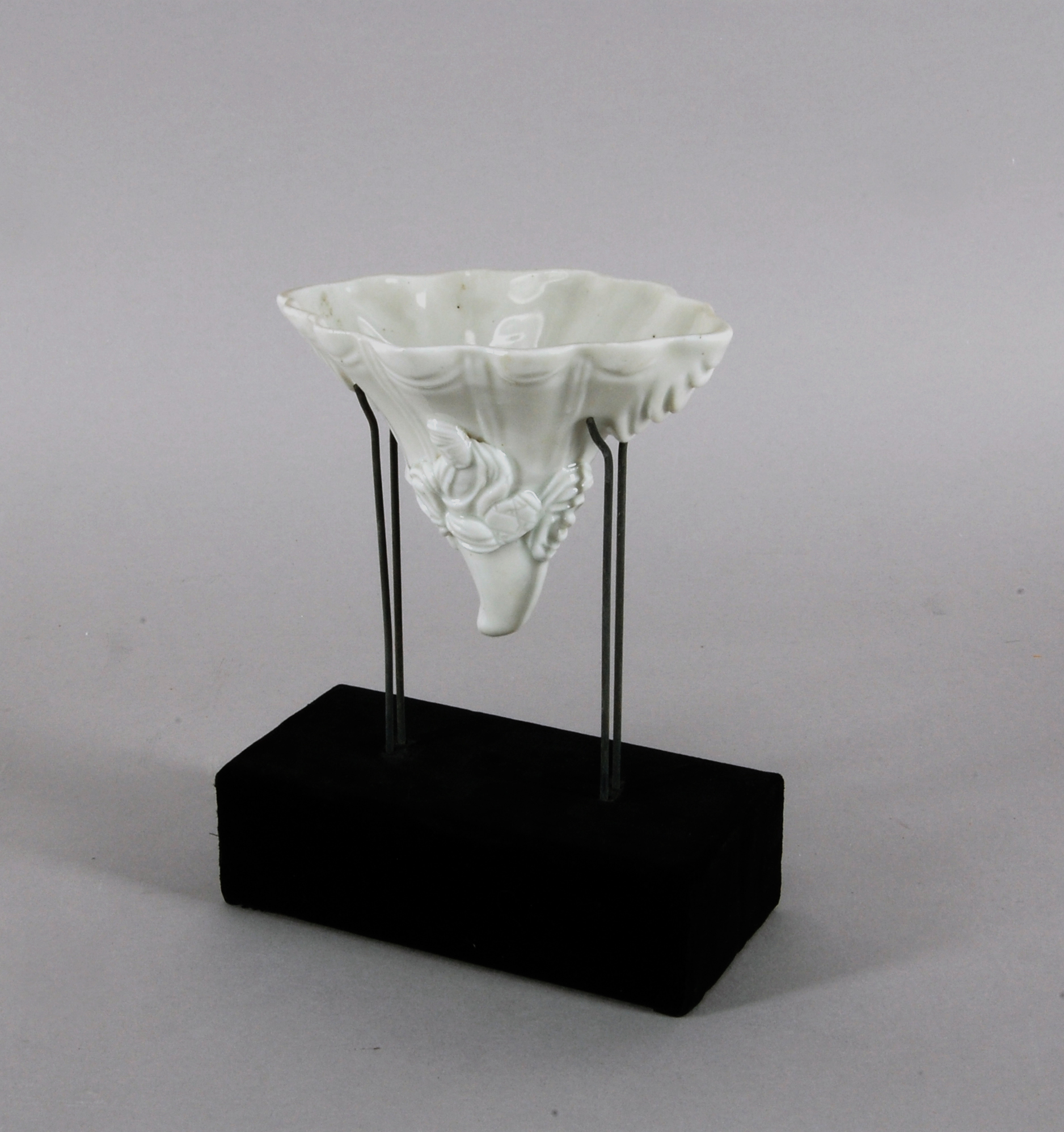 Cup in Shape of Rhinoceros Horn, Porcelain with applied decoration (Dehua ware), 18th century, H. 8.9 cm, The Metropolitan Museum of Art, 2012.527.1, Blanc de Chine