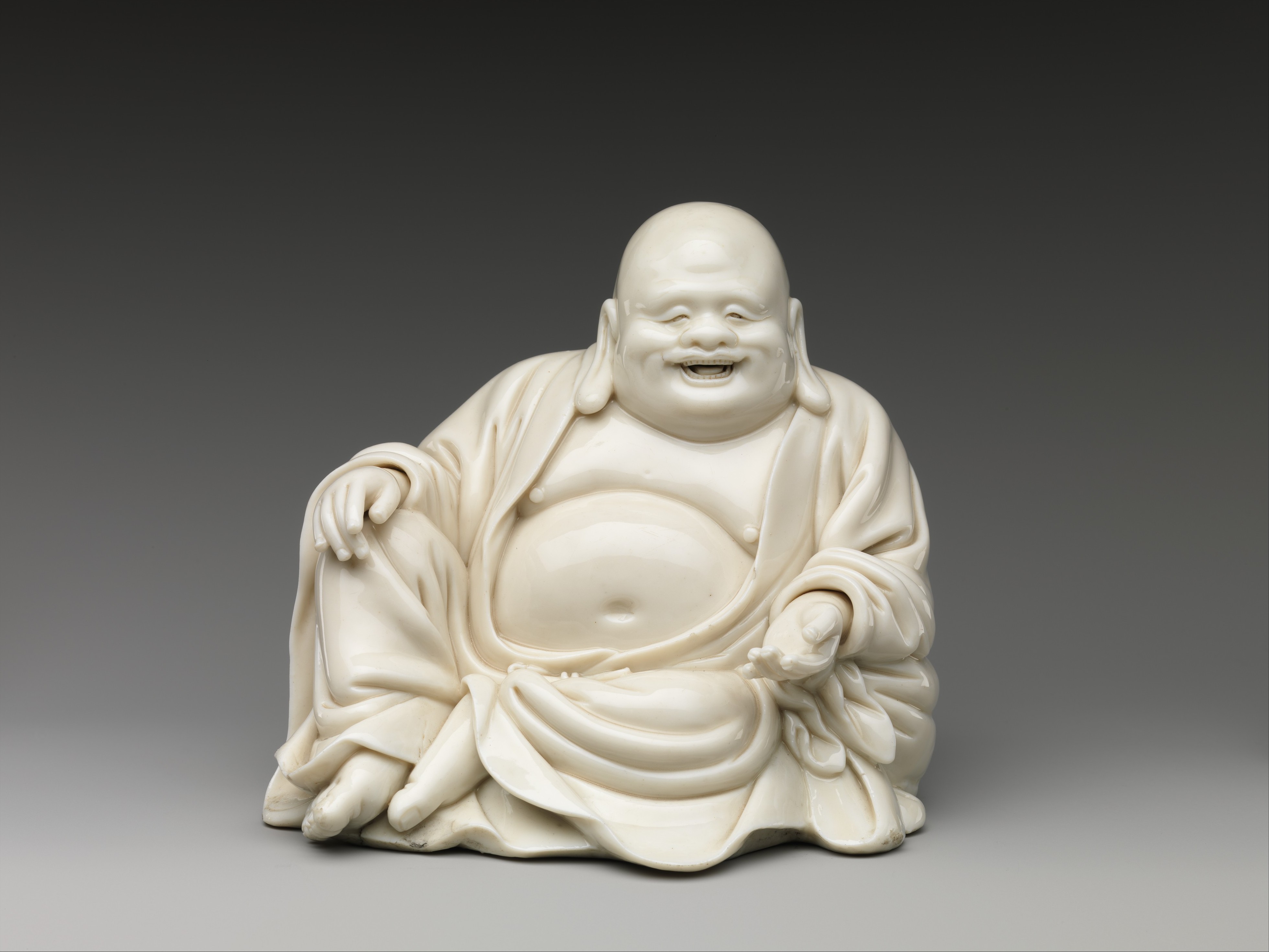 Buddhist Monk Budai, Porcelain with ivory glaze (Dehua ware), 17th–18th century, H. 17.1 cm, The Metropolitan Museum of Art, 32.100.422, Blanc de Chine