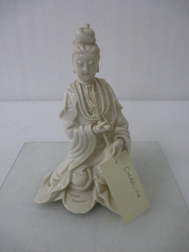 Seated Guanyin Holding a Scroll, Porcelain with a clear glaze, moulded, 1600–1700, Victoria and Albert Museum, CIRC.80-1918, Blanc de Chine